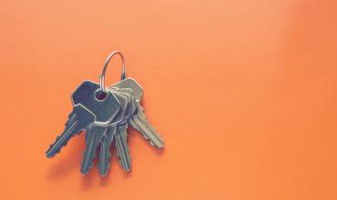 House keys on an orange background