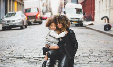 A woman and child hugging