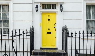 yellow door to a house