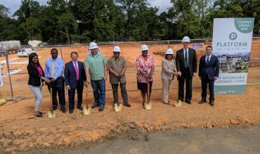 Photo of people preparing to break ground 