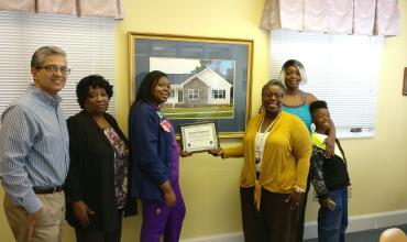 Monroe Community Development Corporation a certificate presentation