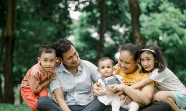 Family sitting on grass