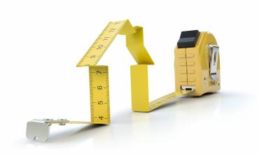 A tape measure in the shape of a house
