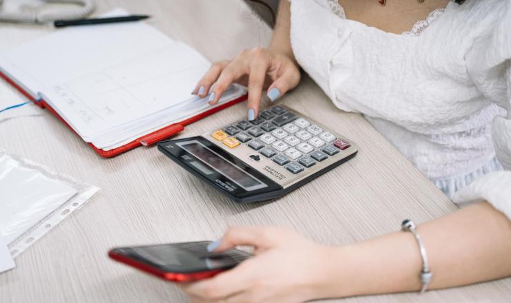 Woman using calculator