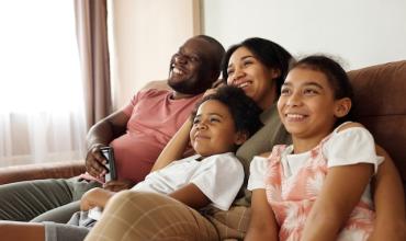 Family sitting on a couch 
