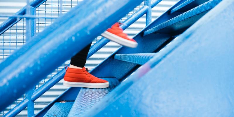 orange shoes on a blue staircase