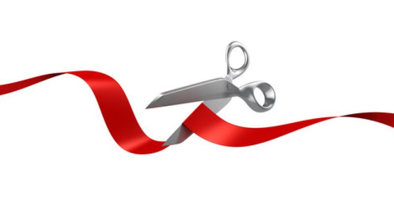 a red ribbon with scissors 