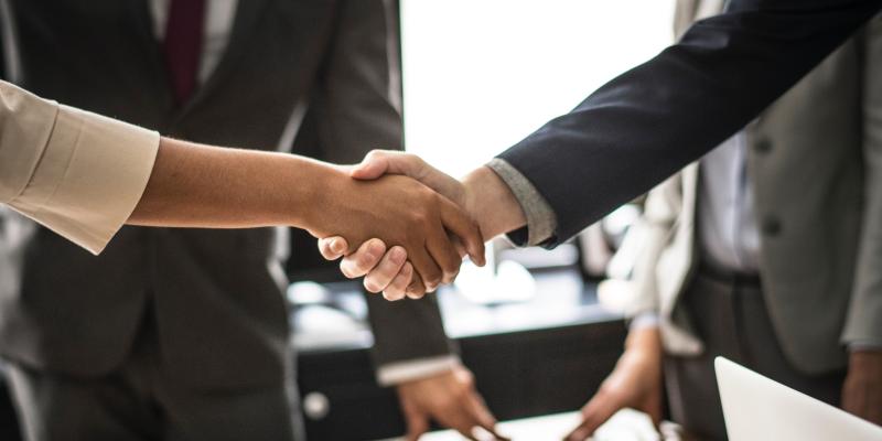 two business people shaking hands