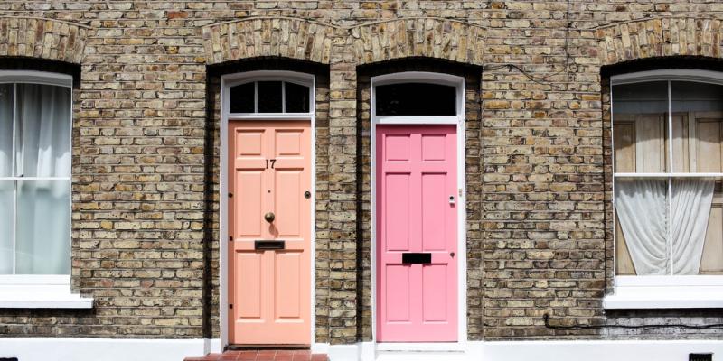a coral door and a pink door side by side