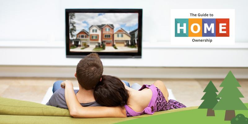 NC Housing Finance Agency Offers New Tool to Help Home Buyers A couple sitting on the couch looking at a home on their TV