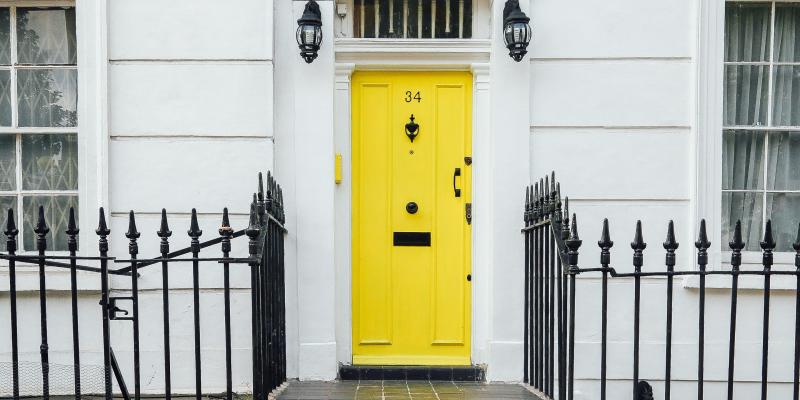 yellow door to a house