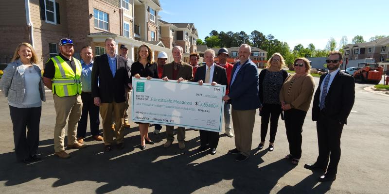 Workforce Housing Check to Be Given at Forestdale Meadows, Burlington, April 17 Group of people holding up a large check
