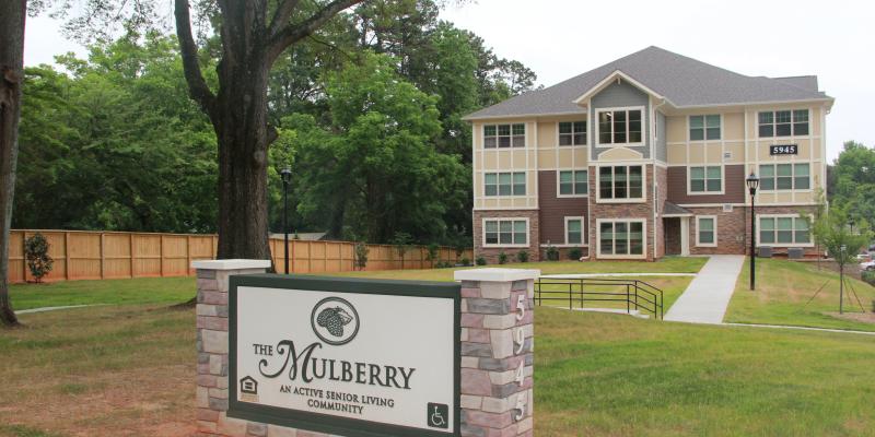 Photo of The Mulberry sign and building in the background