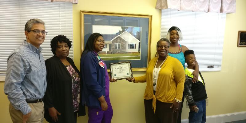 Monroe Community Development Corporation a certificate presentation