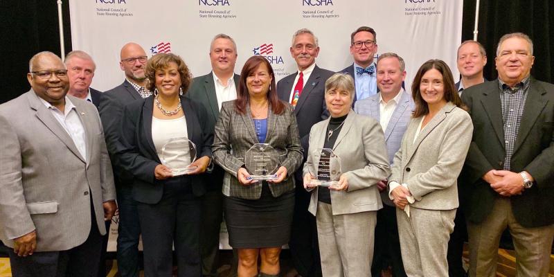 NCHFA staff holding their trophies