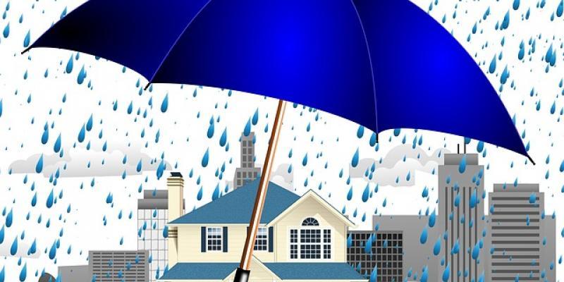 Vector image of a house being covered from rain by a big blue umbrella