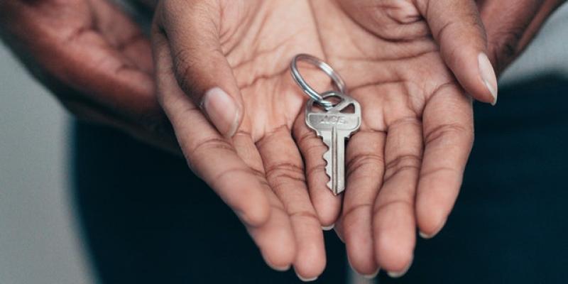 Notice of Funds Available: 2022 Supportive Housing Development Program Two hands holding house keys