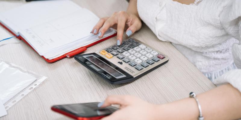 Woman using calculator
