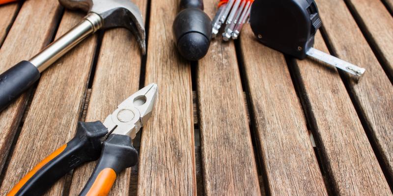 Tools laying on a wooden deck